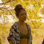 Kiara’s stamp print shirt, olive green bikini top, and orange denim shorts on Outer Banks