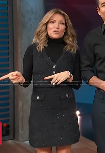 Kit’s black knit vest and mini skirt on Access Hollywood