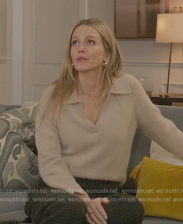 Laura’s beige v-neck sweater on All American
