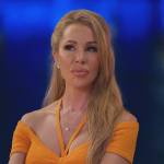 Lisa’s orange knit top and skirt on The Real Housewives of Miami