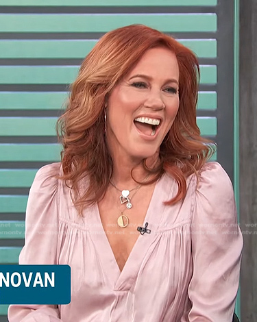 Elisa Donovan’s pink v-neck satin top on Access Hollywood
