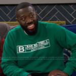 Malcolm’s green Black Wall Street sweatshirt on The Neighborhood