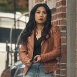 Mel’s orange leather moto jacket and front split jeans on The Equalizer