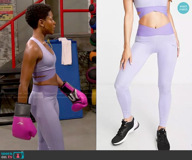 Puma Training Desert banded leggings in lilac worn by Necie (Chelsea Harris) on The Neighborhood