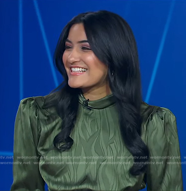 Reena Roy’s green mock neck satin dress on Good Morning America