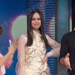 Sofia Carson’s ivory chain mini dress on Access Hollywood