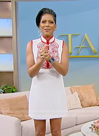Tamron’s white embroidered mini dress on Tamron Hall Show