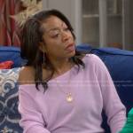 Tina’s lilac one shoulder sweater and black cargo pants on The Neighborhood