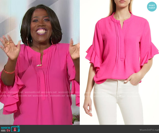 Vince Camuto Ruffle Sleeve Split Neck Blouse worn by Sheryl Underwood on The Talk