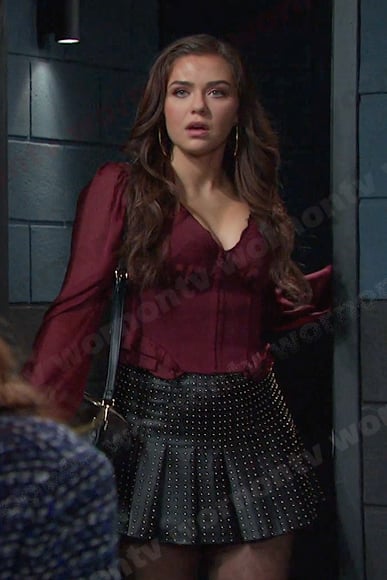 Ciara’s burgundy corset top and black studded skirt on Days of our Lives