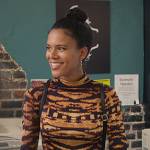Fay’s orange tie dye turtleneck top on Grand Crew