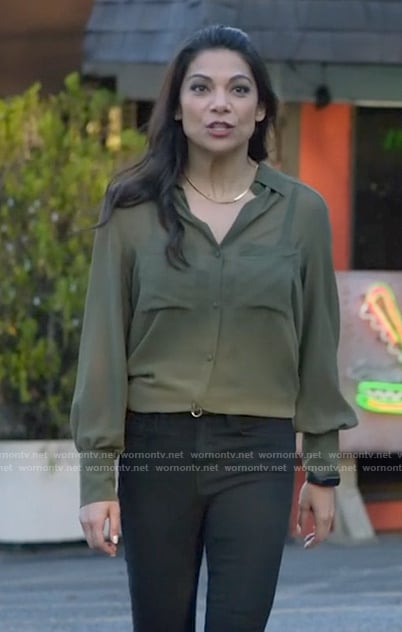 Helen’s sheer green button down shirt on True Lies