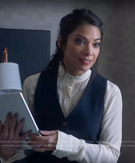 Helen’s white ruffle trim blouse and navy waistcoat on True Lies