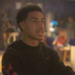 Junior’s black Off-White logo sweater on Grown-ish