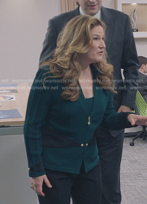 Katherine’s green cardigan on American Auto