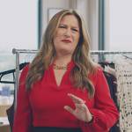 Katherine’s red chain link blouse on American Auto
