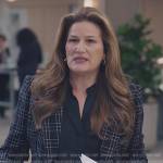 Katherine’s black satin blouse and checked blazer on American Auto