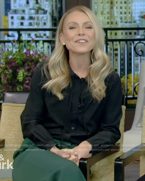 Kelly’s black blouse and green pants on Live with Kelly