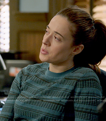 Kim’s teal and black printed sweater on Chicago PD