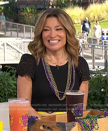 Kit’s black ruffle sleeve top and print shorts on Access Hollywood