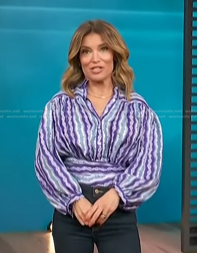 Kit’s purple floral striped blouse on Access Hollywood