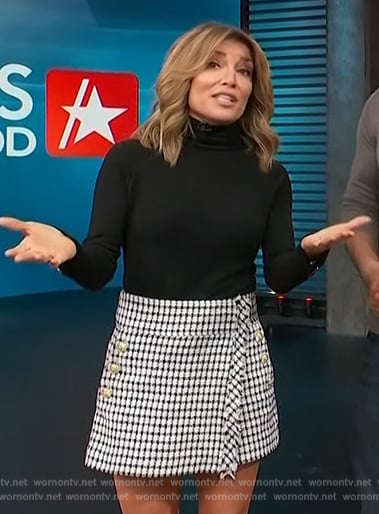 Kit’s black sweater and tweed mini skirt on Access Hollywood