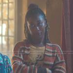 Malika’s orange top and striped knitted cardigan on Good Trouble