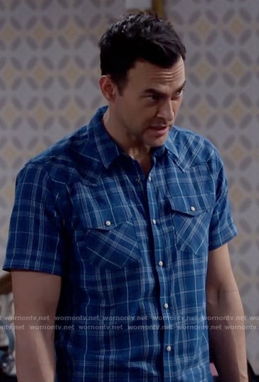 Max’s blue plaid short-sleeve shirt on Call Me Kat