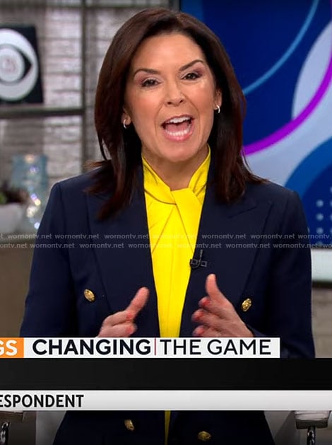Meg Oliver’s yellow twist neck dress and navy blazer on CBS Mornings