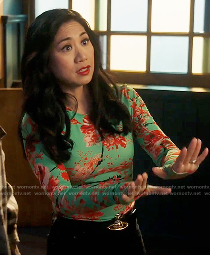 Mel’s aqua floral barbed wire print top on The Equalizer
