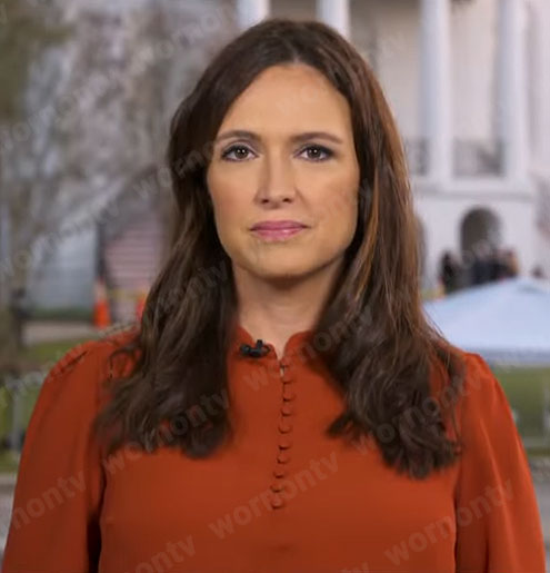 Nikki Battiste’s orange buttoned blouse on CBS Mornings