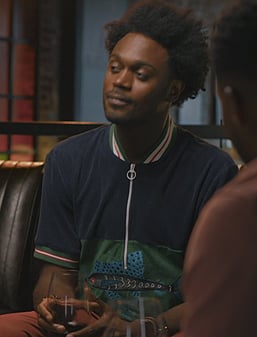 Noah’s fish print polo on Grand Crew