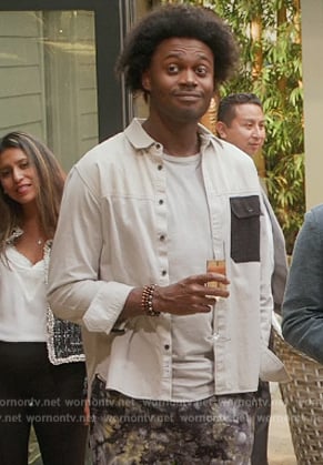 Noah’s white shirt with contrast pocket on Grand Crew