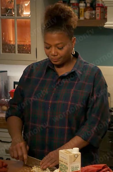 Robyn’s plaid shirt and silver triangle hoop earrings on The Equalizer
