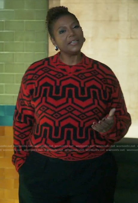 Robyn’s red and black printed seater on The Equalizer