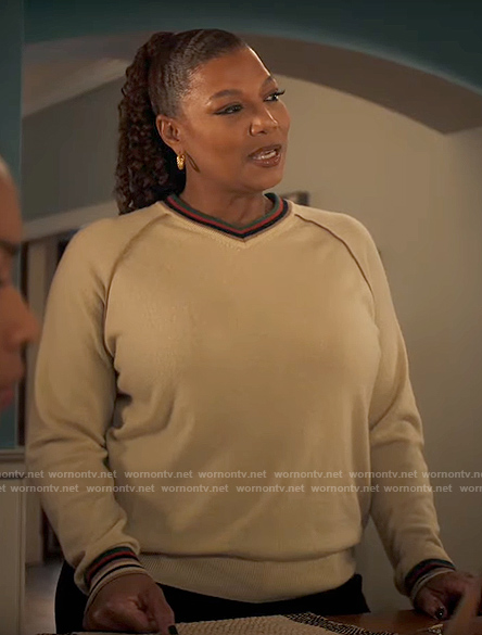 Robyn’s cream stripe-trim sweater on The Equalizer