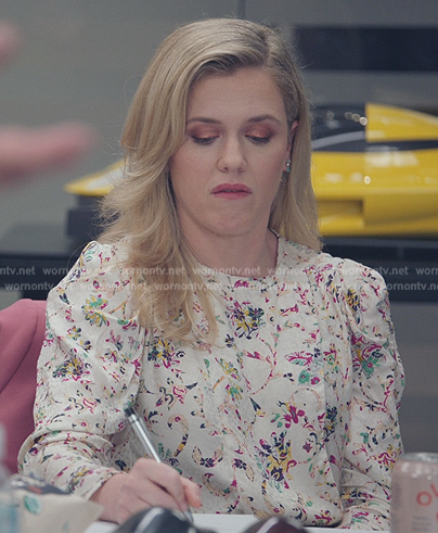 Sadie’s white floral print blouse on American Auto