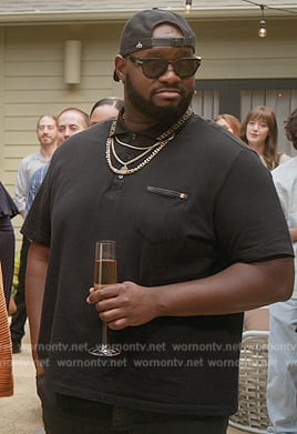 Sherm’s black polo on Grand Crew
