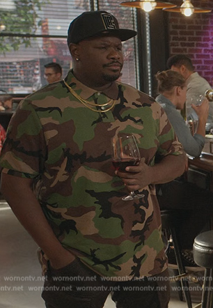 Sherm’s camo print polo on Grand Crew