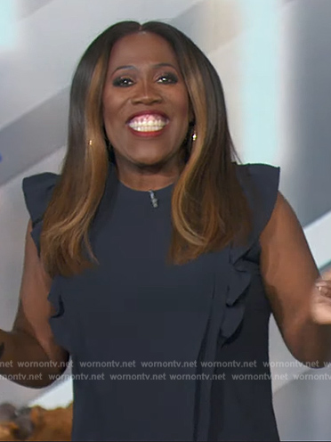 Sheryl’s navy ruffle top on The Talk