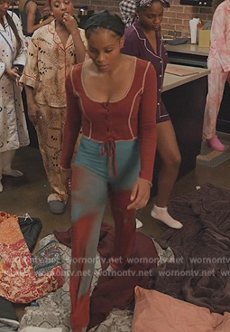 Simone’s orange lace-up front top and pants on All American Homecoming