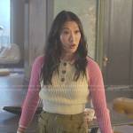 Sumi’s pink colorblock polo sweater and olive green pants on Good Trouble