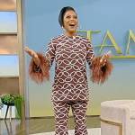 Tamron’s brown chain print feather trim top and pants on Tamron Hall Show