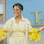 Tamron’s yellow printed blouse and skirt on Tamron Hall Show