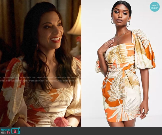 ASOS DESIGN Exaggerated blouson sleeve mini dress with wrap waist in tropical palm print worn by Helen Tasker (Ginger Gonzaga) on True Lies