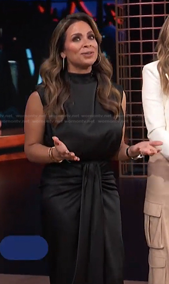 Carolina Bermudez’s black satin top and skirt on E! News