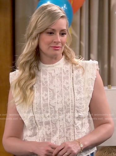 Gemma’s ivory star embroidered top on The Neighborhood