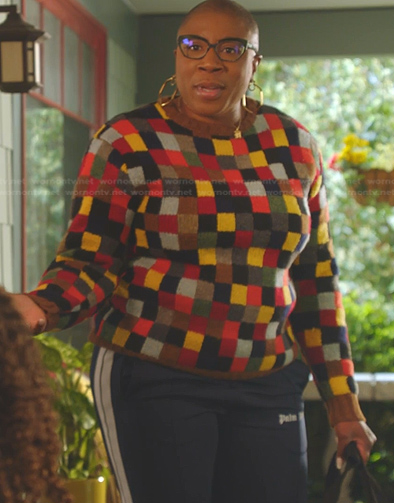 Hen’s patchwork sweater and side stripe track pants on 9-1-1