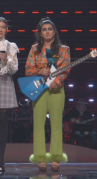 Kate Cosentino’s orange floral blazer and green feather trim pants on The Voice