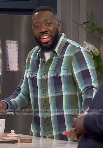 Malcolm’s green and navy plaid shirt on The Neighborhood